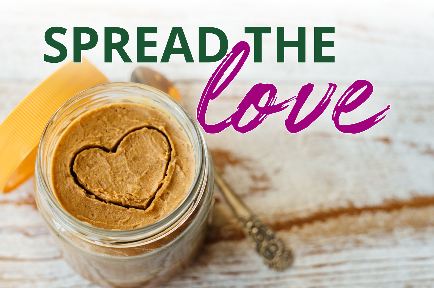 opened peanut butter jar with a heart shape drawn into it | donations | spread the love green and purple text | Galloway | Berks | warehouse