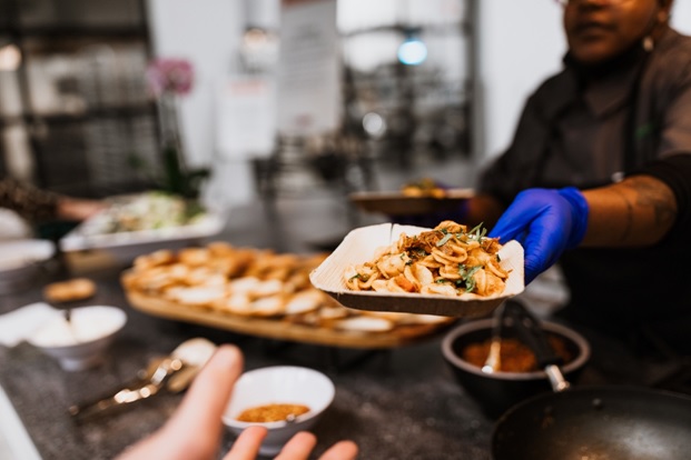Person holding a plate of food